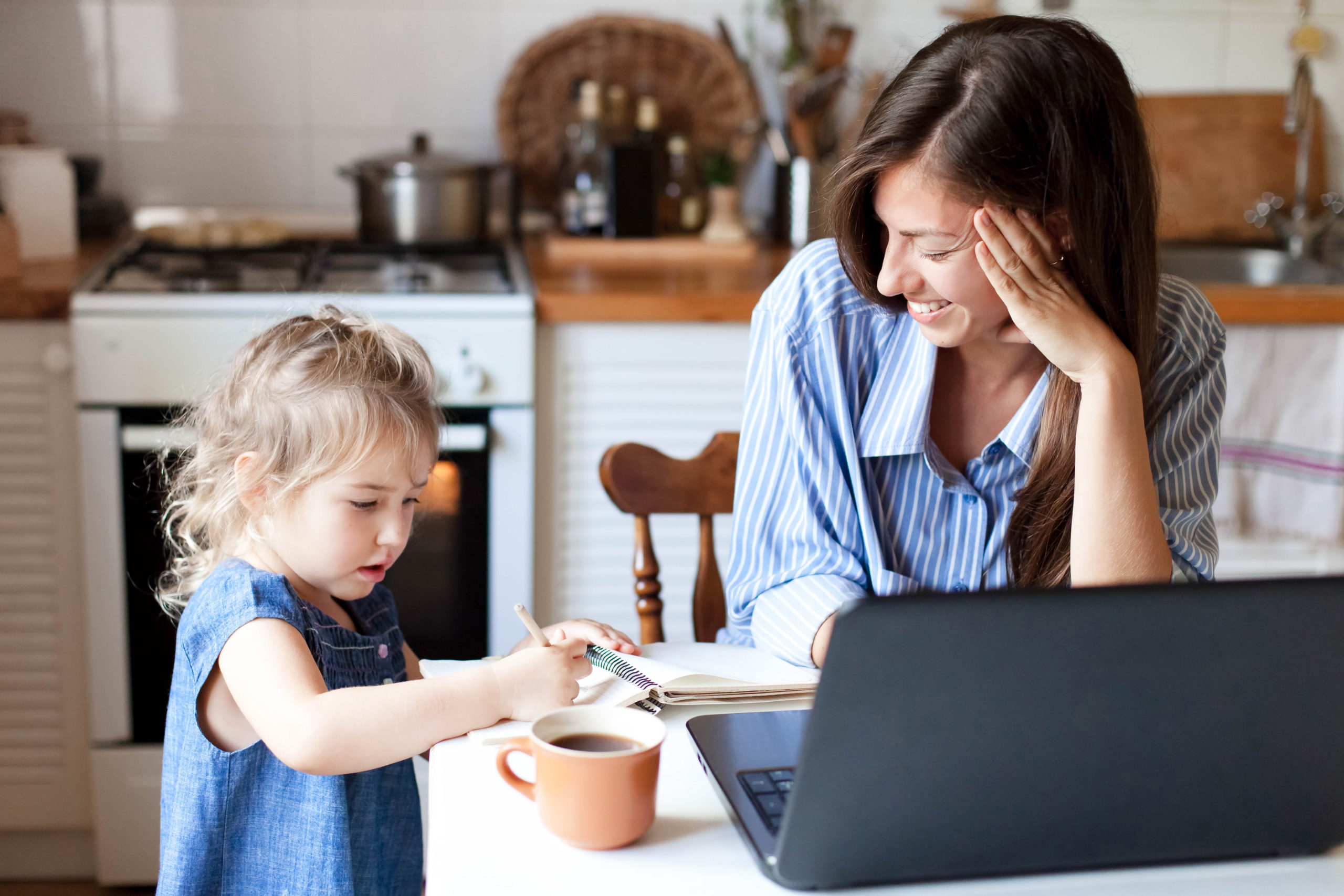 Image: A mom balances working from home with educating her child. Learn how to overcome homeschool burnout.