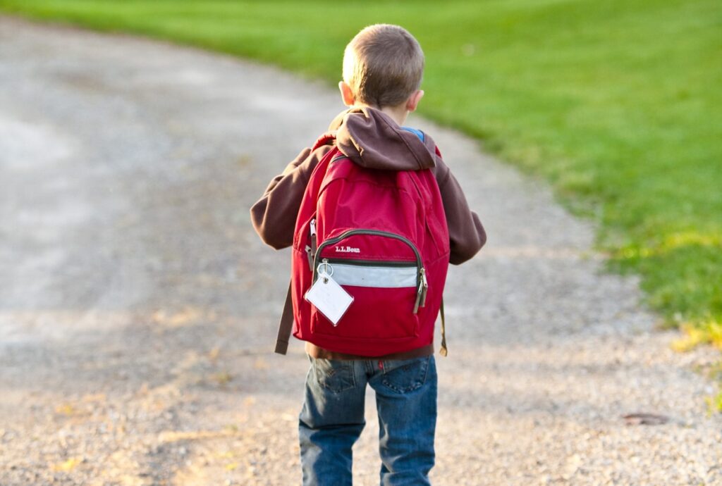 boy with backpack going to school