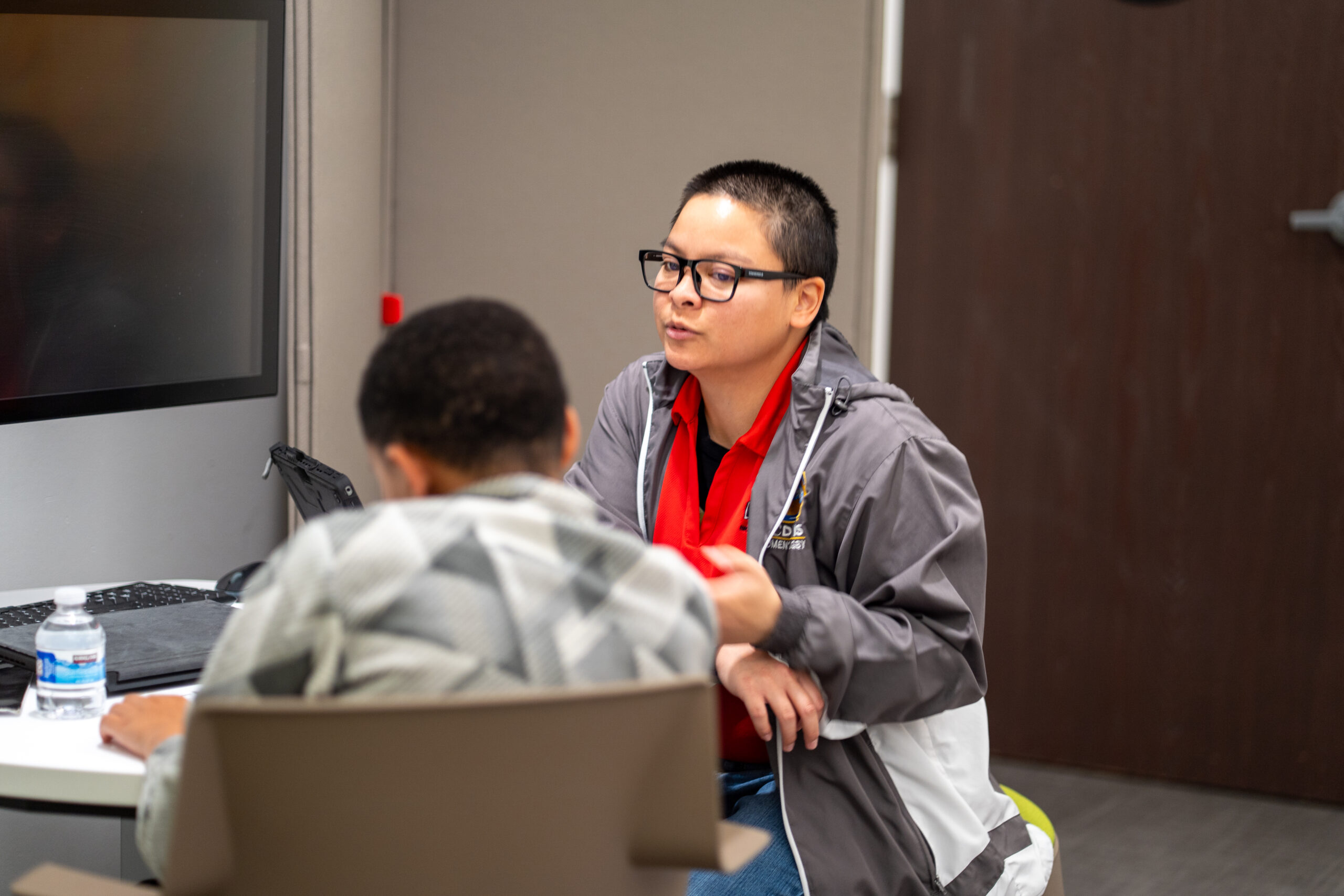 Miracle math coach working with a student